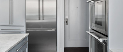 Longer wait times expected due to ongoing supply chain disruptions; up to 12 months for high-end appliance brands (photo of Bolster's Upper East Side renovation kitchen / refrigerator